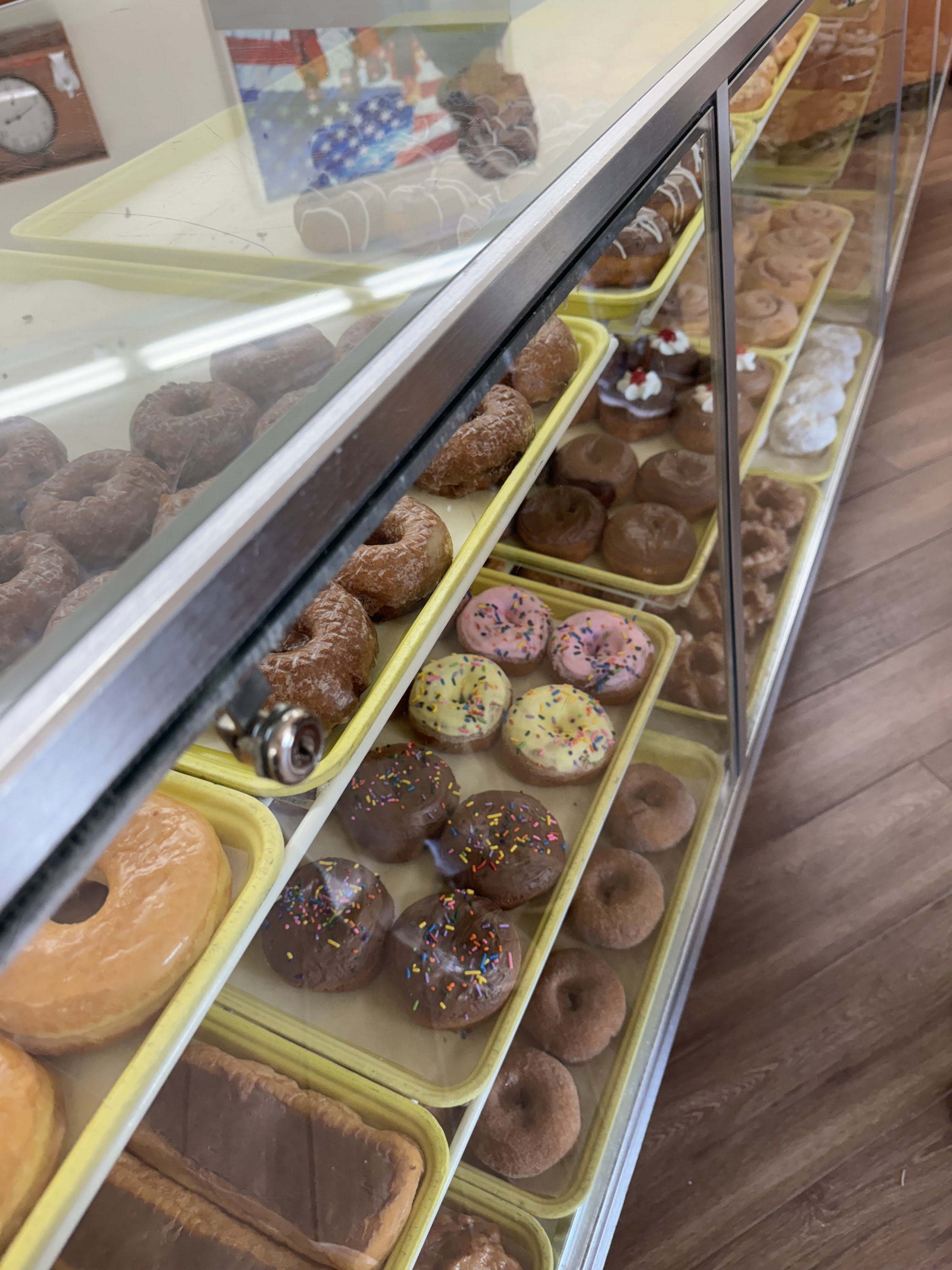 The display case at Marge's, full of glazed and chocolate donuts